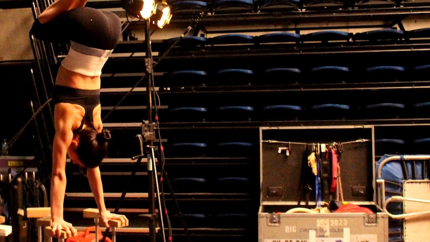 A rehearsal of a Cirque du Soleil balancing act backstage in Canberra.