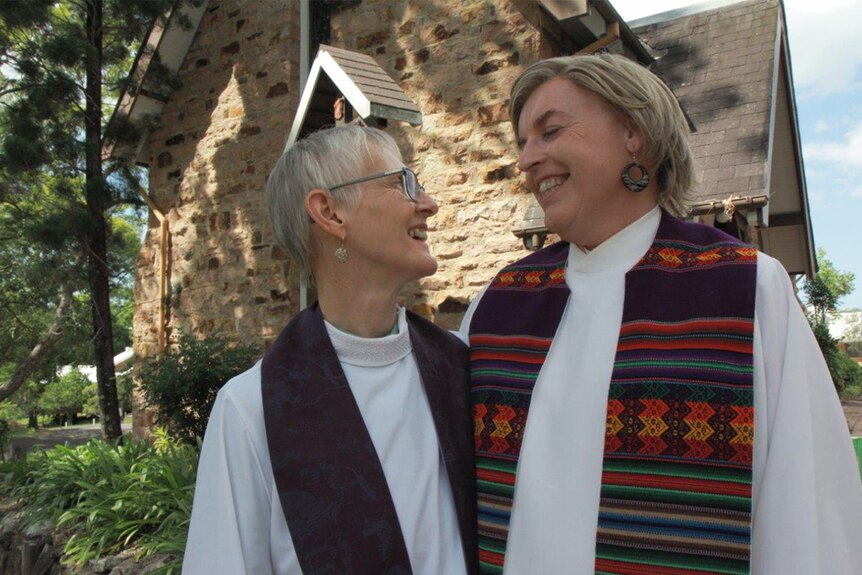 Penny Jones with Jo Inkpin, outside their church.