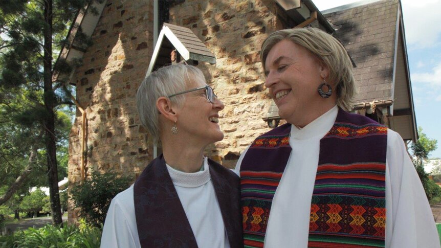 Penny Jones with Jo Inkpin, outside their church.