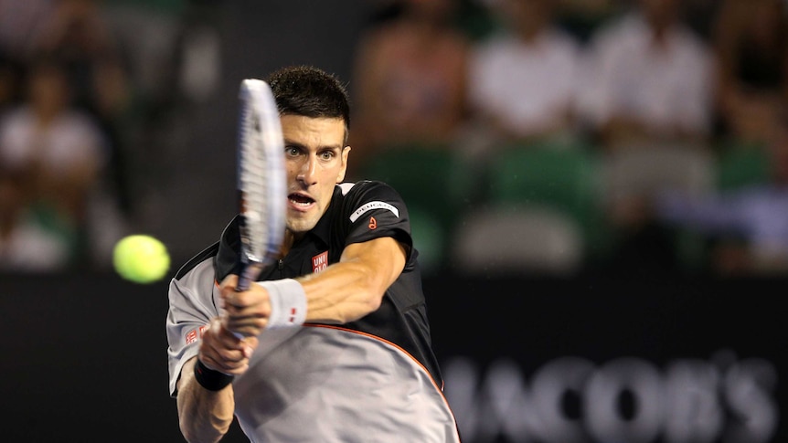 Novak Djokovic hits a backhand in his win over Denis Istomin