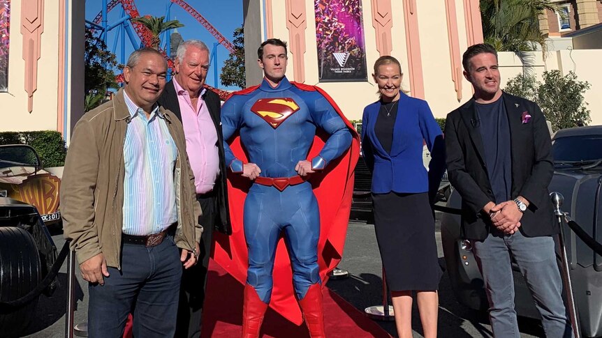 Theme park executives and government officials - along with Superman, outside Movie World.