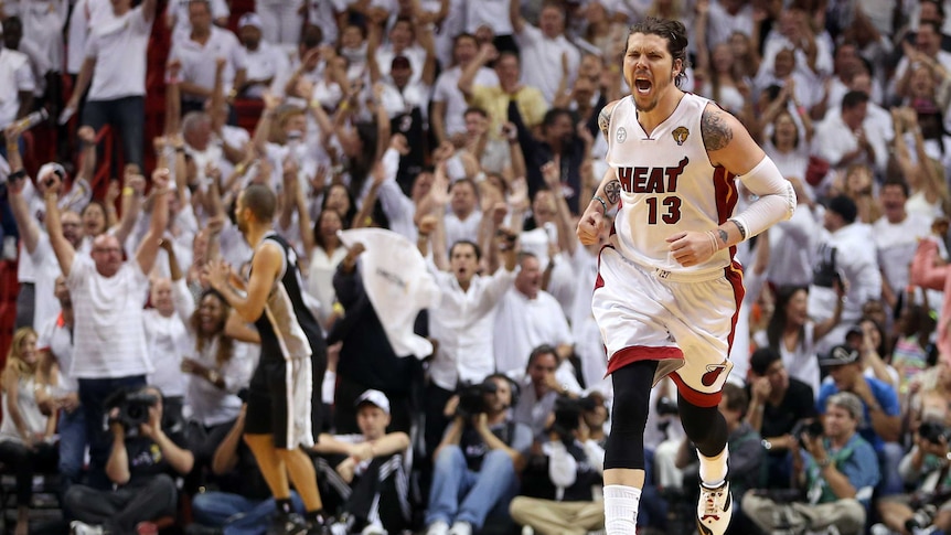 Miami guard Mike Miller celebrates a three-pointer against San Antonio.