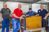 Men's Shed group inside a shed in Brisbane.