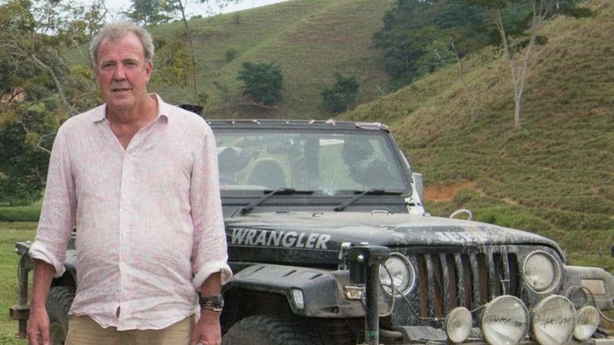 The Grand Tour hosts on location with a Jeep wrangler behind them