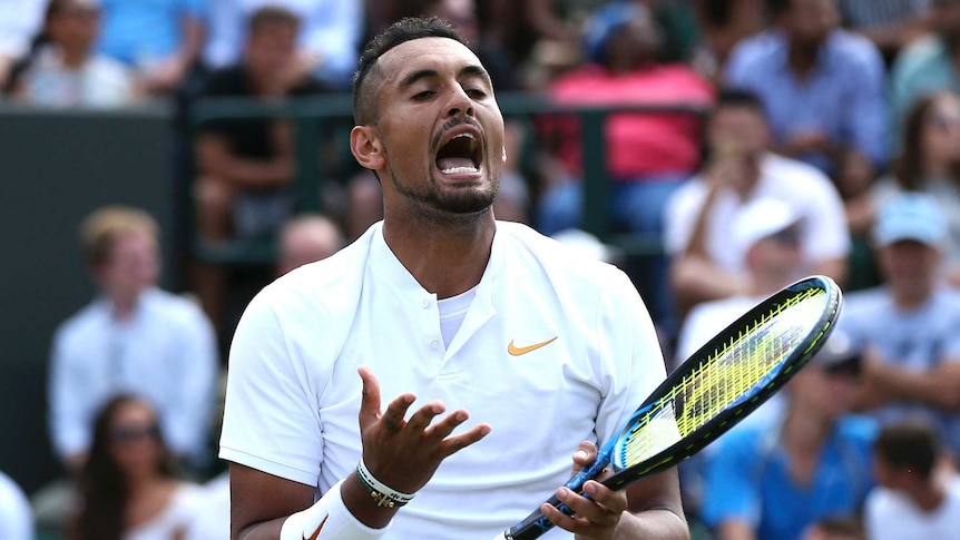 Nick Kyrgios reacts to a missed shot at Wimbledon