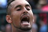 Nick Kyrgios reacts to a missed shot at Wimbledon