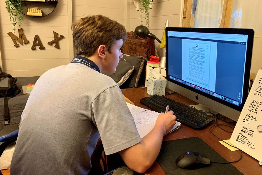 Townsville Year 12 student Max Robson doing home-schooling on his computer in his room in North Queensland.