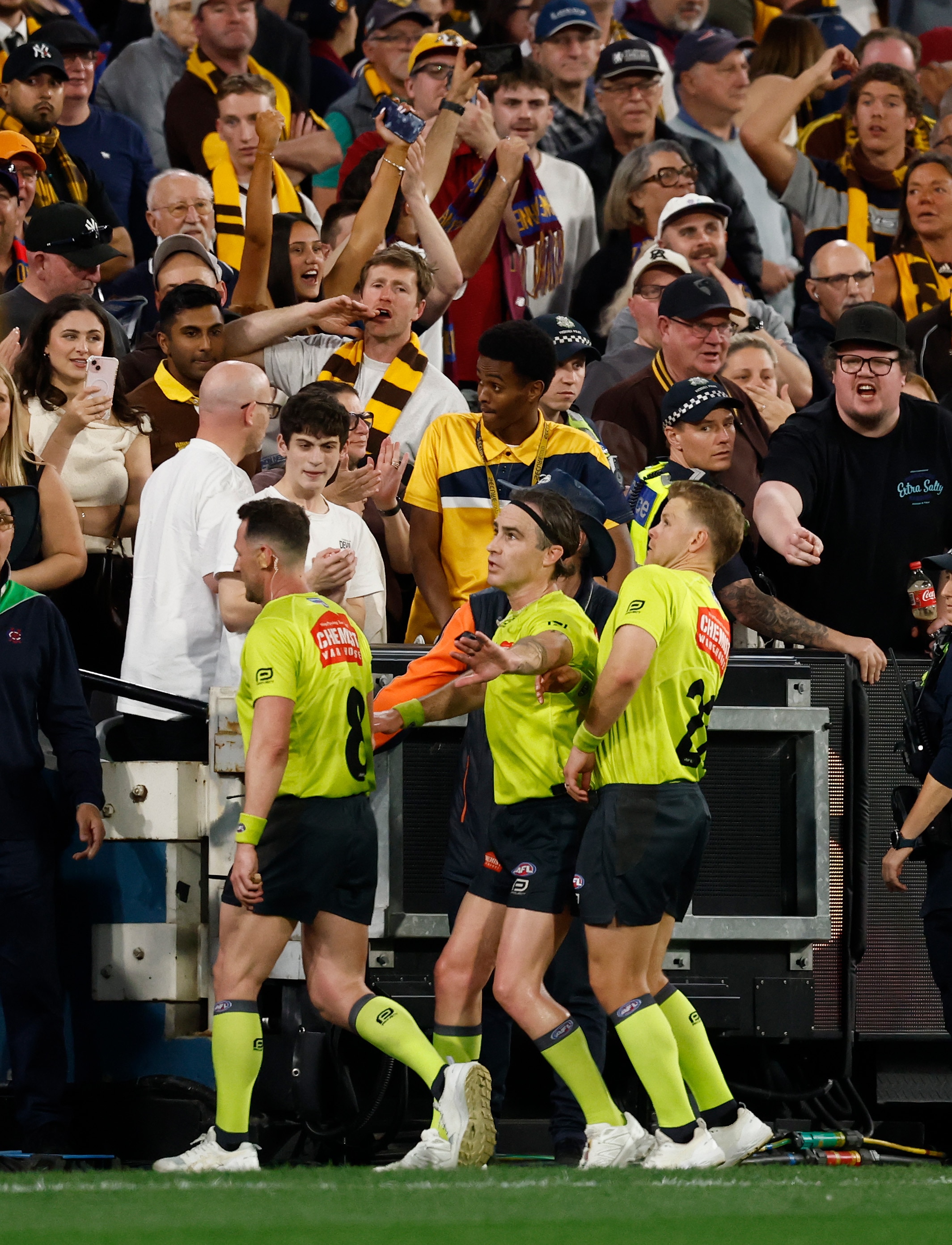 AFL bans loom for bottle-throwing Hawks fans