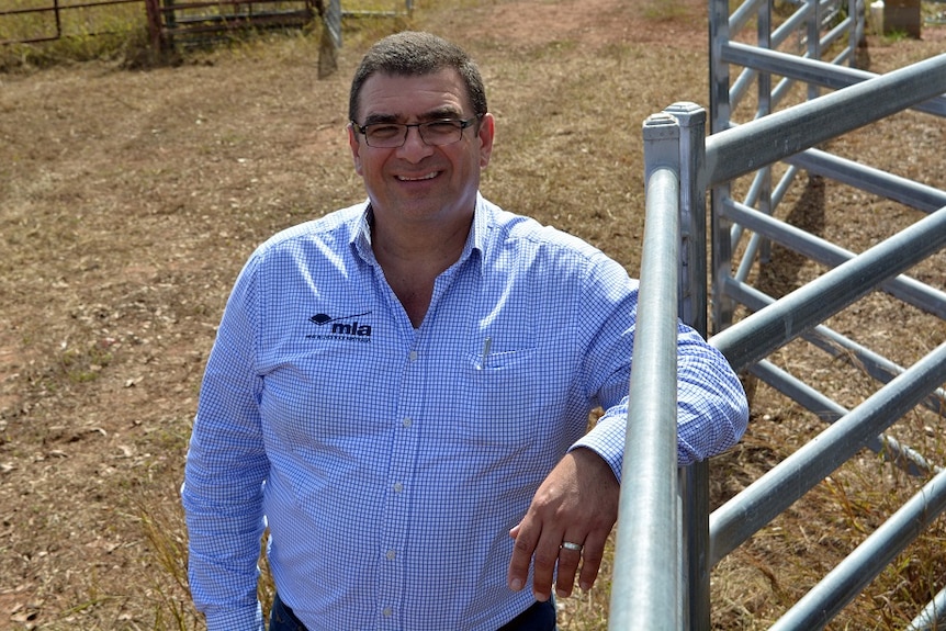 Jason Strong standing in a cattle yard.