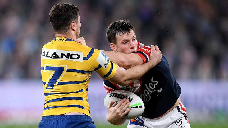 Parramatta Eels' Mitchell Moses tackles Sydney Roosters' Luke Keary during their NRL clash.