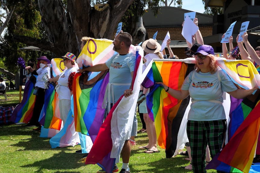 Members of the Rainbow Community Angels dancing outside the Shepparton Library 