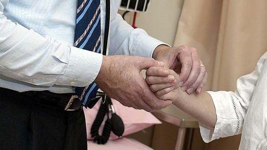 A doctor checks a patient (AFP: Norwood Abbey, file photo)