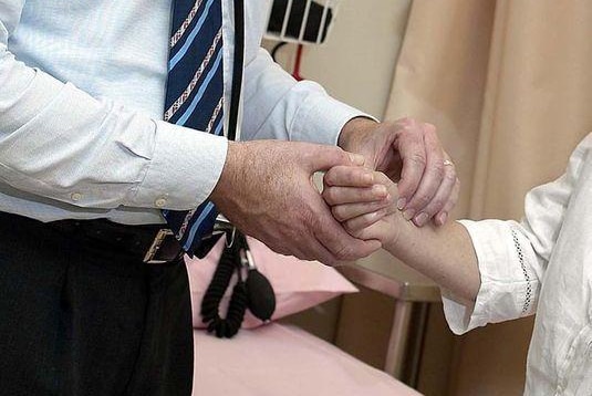 A doctor checks a patient (AFP: Norwood Abbey, file photo)