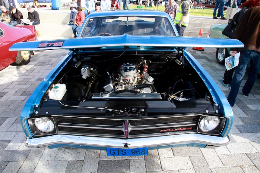 A blue Falcon GTS with its bonnet up