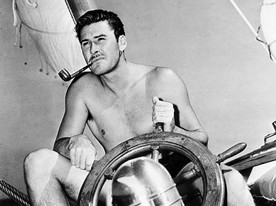Old black and white photo of errol flynn.