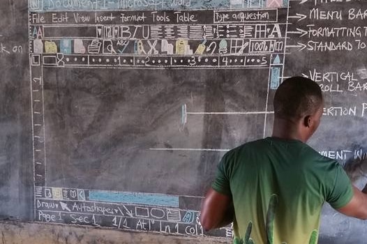Teacher drawing Microsoft Word on a blackboard