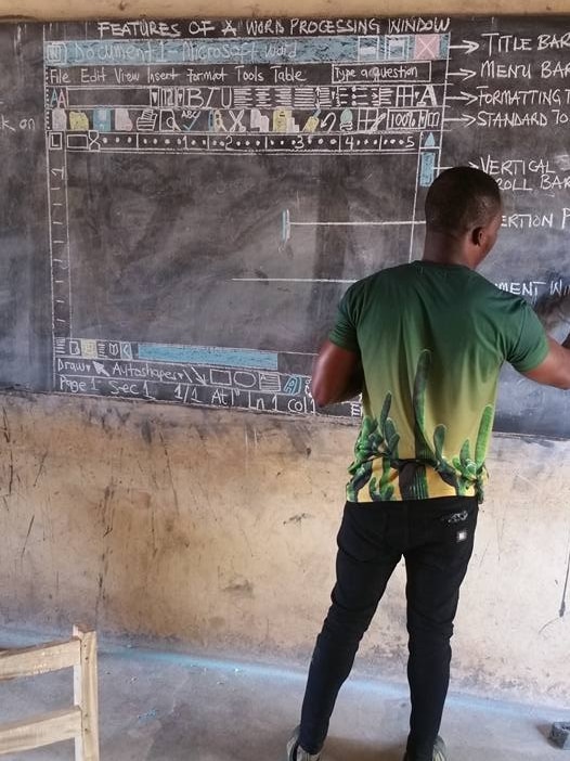 Teacher drawing Microsoft Word on a blackboard