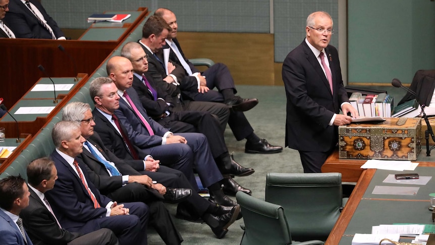 PM Scott Morrison speaks in Parliament while his front bench behind him has 9 men and no women.