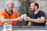 Richard Watkins and Adrian Graeber share a beer.