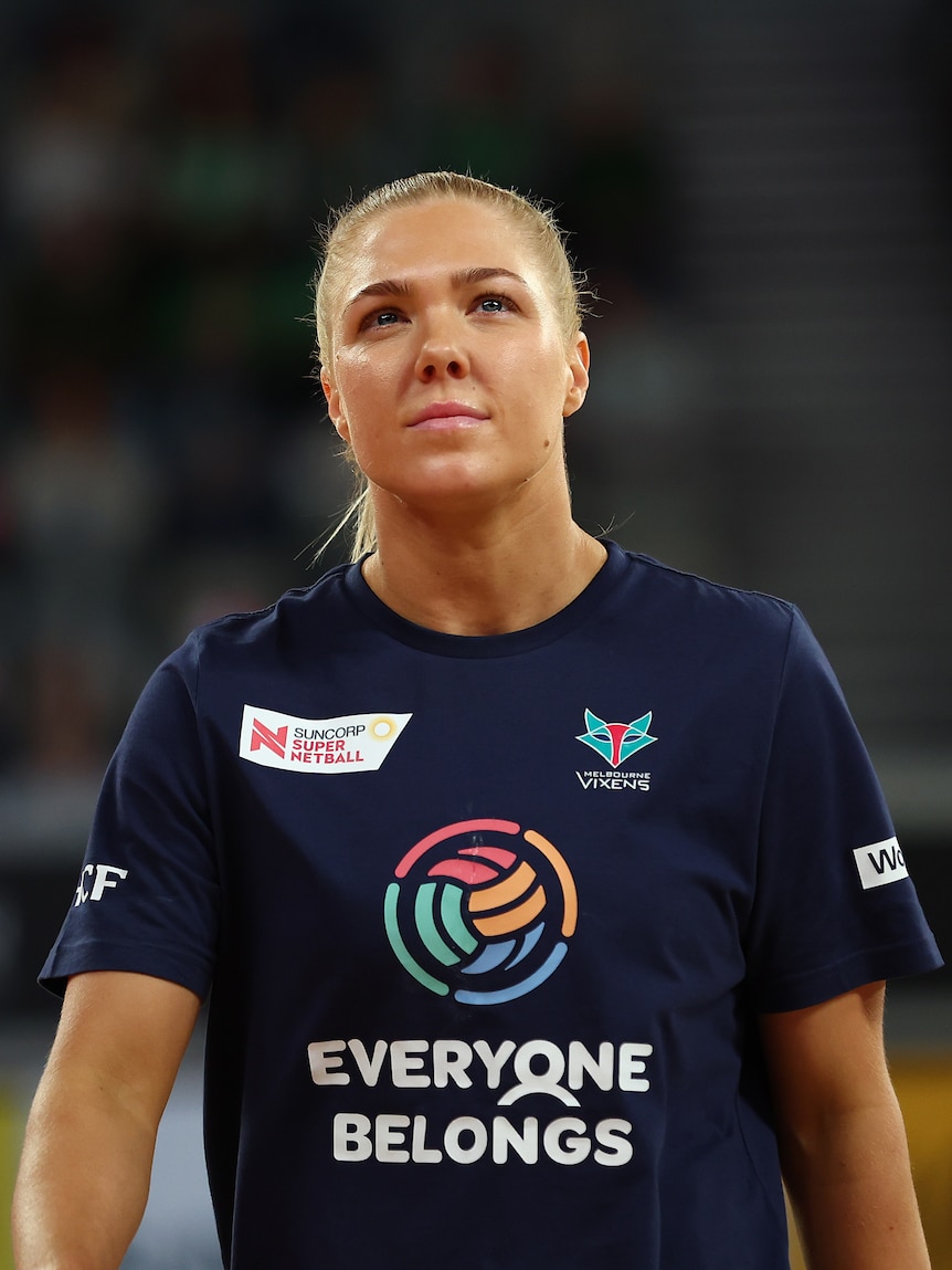 Kate Moloney wears a navy shirt with the Vixens and Super Netball logos that says Everybody Belongs