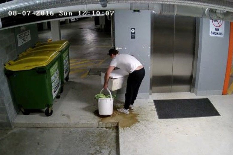 A restaurant worker spills prawns in an apartment carpark.