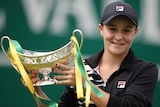 Ashleigh Barty holds up the Birmingham final trophy.
