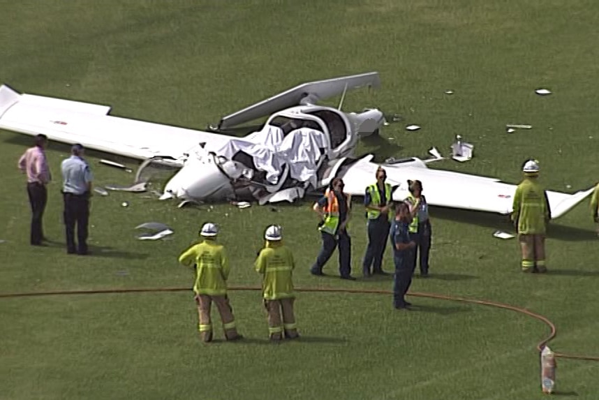 Emergency crews at the scene of a plane crash near Jimboomba.