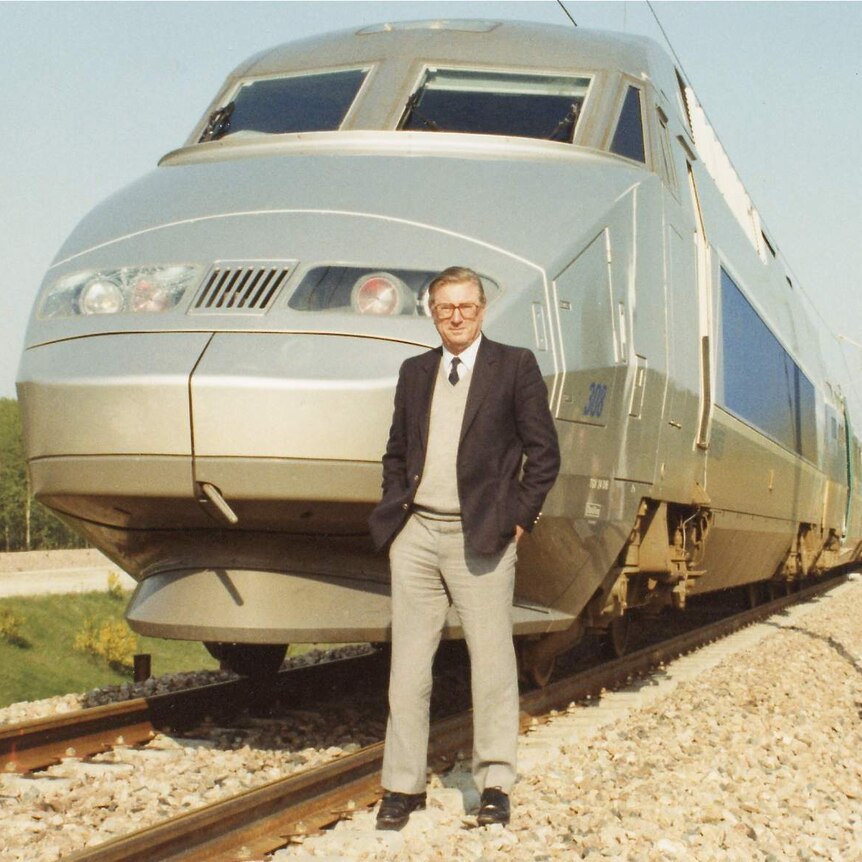 Dr Paul Wild on track in front of a TGV, France in 1989.