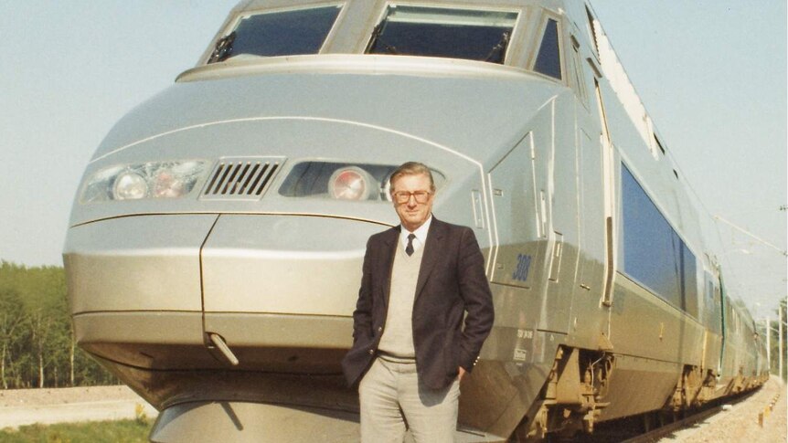 Dr Paul Wild on track in front of a TGV, France in 1989.