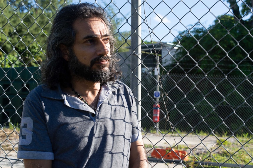 Hani standing next to a fence on Nauru