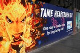 A colourful advertisement for Zantac painted on a fence in Melbourne in street art style.