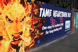 A colourful advertisement for Zantac painted on a fence in Melbourne in street art style.