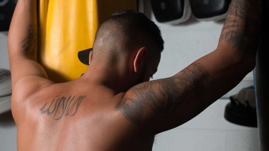 Tattooed back of gym owner Jacob Najjar.
