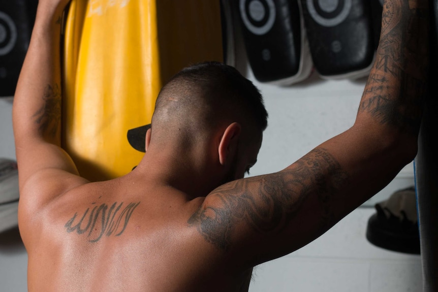Tattooed back of gym owner Jacob Najjar.