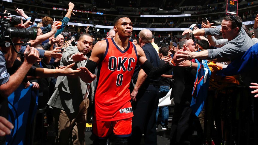 Oklahoma City Thunder guard Russell Westbrook celebrates after hitting a game-winning three pointer.