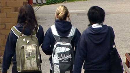 Three school girls walking