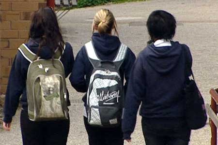 Three school girls walking