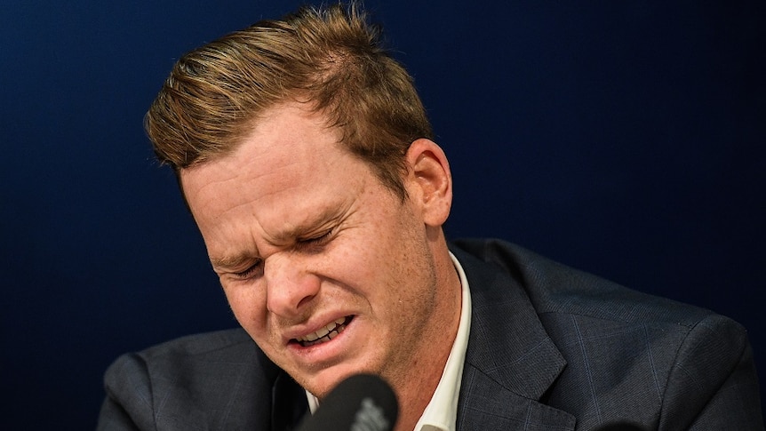 Cricketer Steve Smith looks pained in front of press conference
