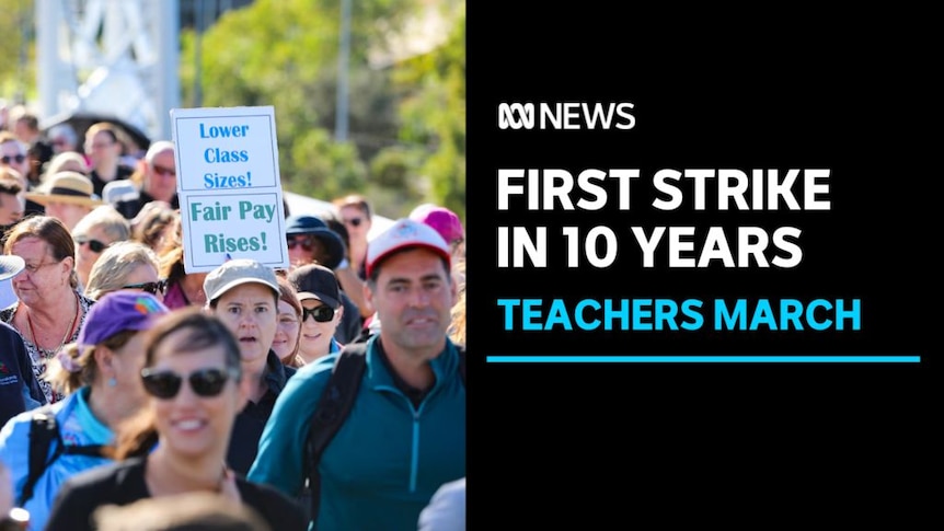 First Strike in 10 Years, Teachers March: People march together. Someone holds a sign saying 'Lower Class Sizes! Fair Pay Rises'
