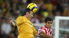Farewell appearance ... Stan Lazaridis heads the ball against Paraguay