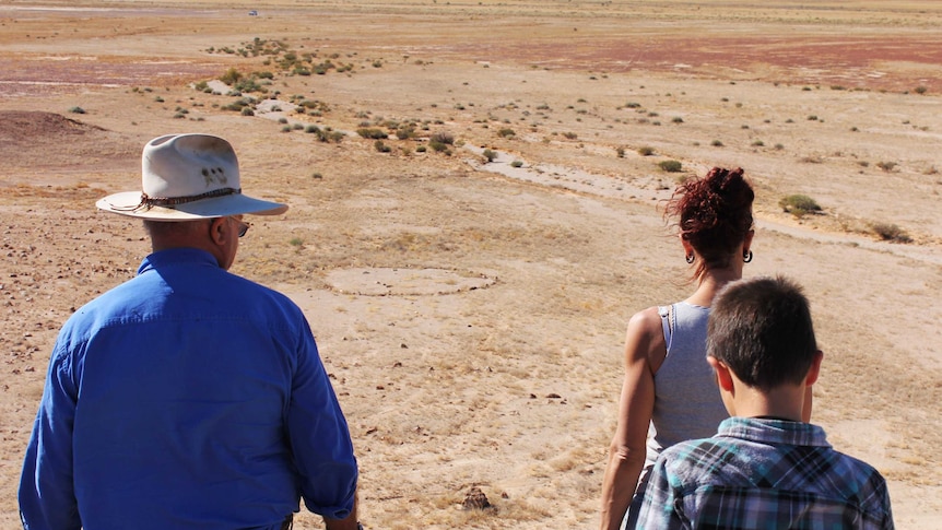 George Gorringe and his family look down on one of the stone circles found in Queensland's remote channel country.