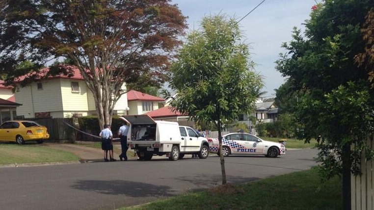 Police outside a property at Wavell Heights on Brisbane's northside where a woman awas shot in the chest on December 10, 2013.