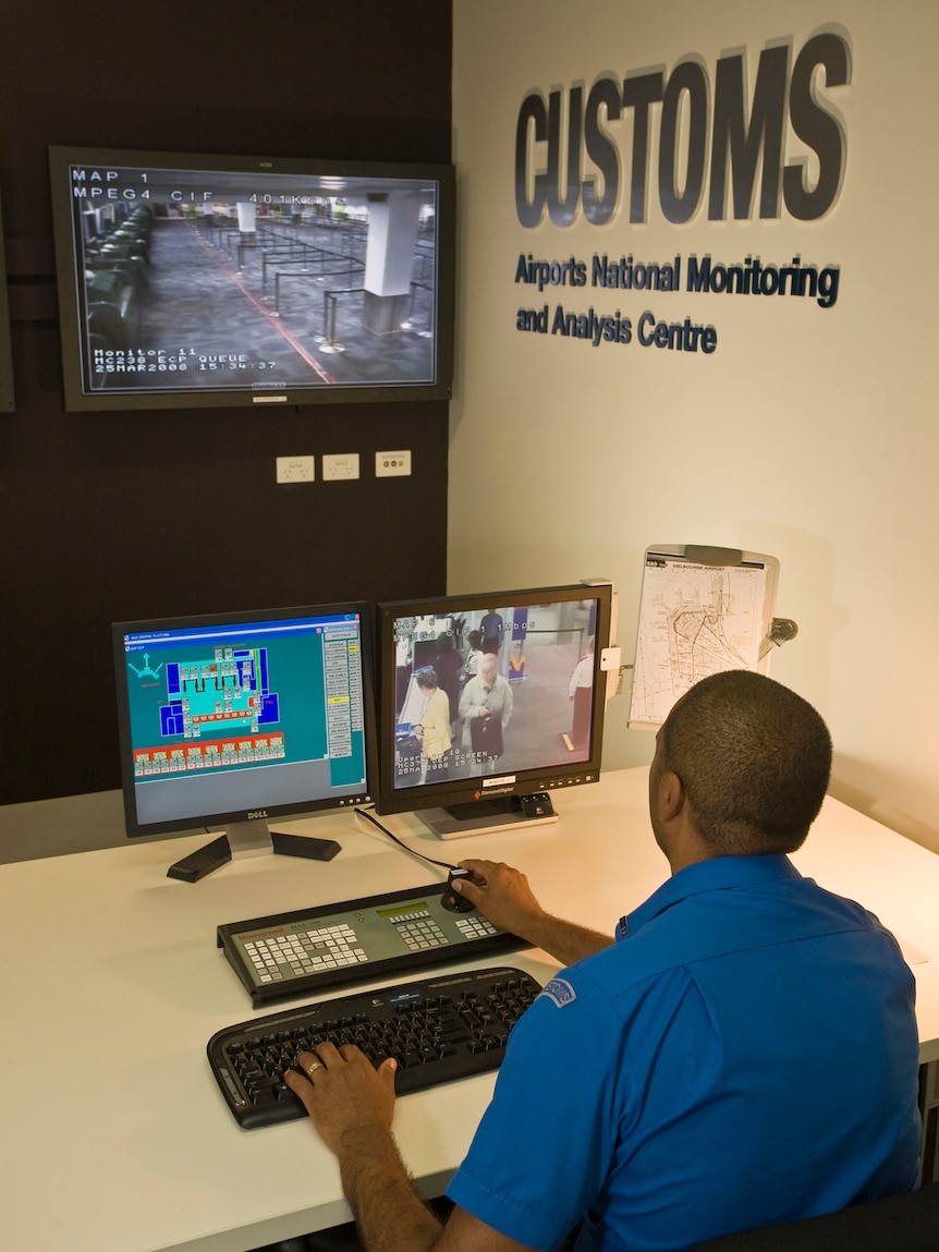 A Customs officer works at the Airports National Monitoring and Analysis Centre.