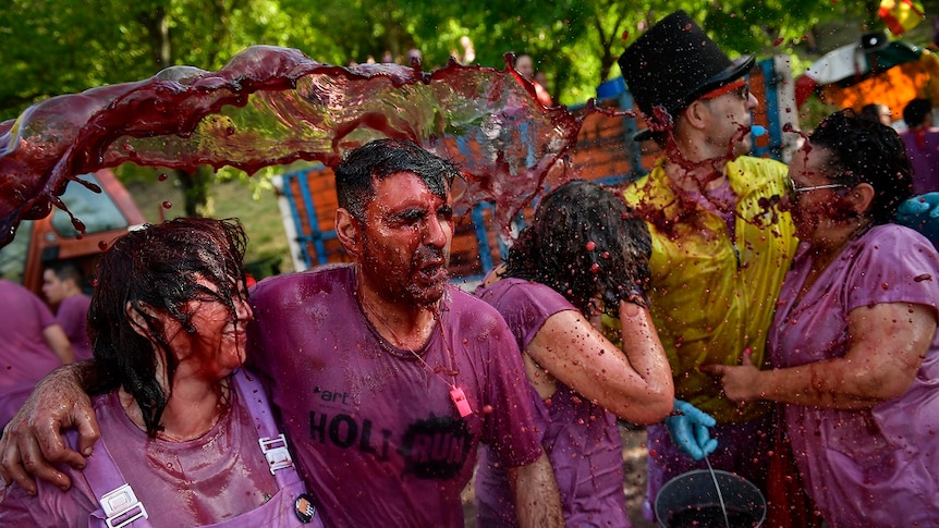 People take part in a wine battle, in the small village of Haro, northern Spain, Saturday, June 29, 2019.
