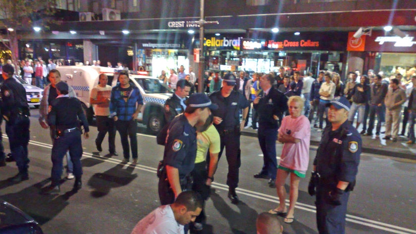 Police attend to the scene of a violent confrontation in the Sydney nightclub district of Kings Cross.