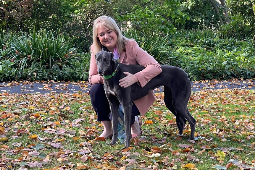 Madeleine Ogilvie with a greyhound.