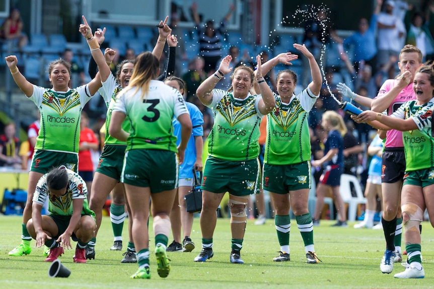 Cook Island players celebrate win over England
