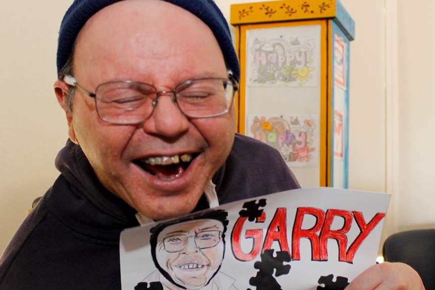 Garry holding his drawing