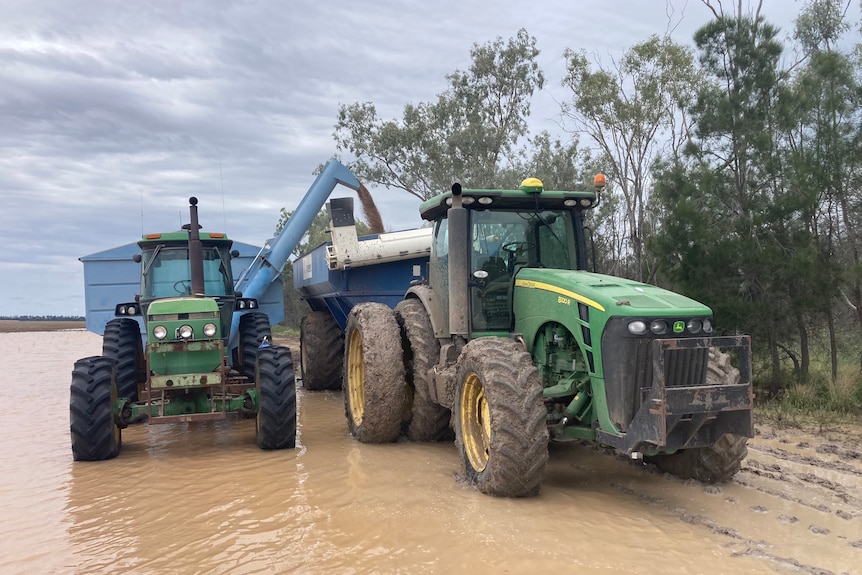 Tractor sits in flood waters