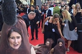 Protesters dressed as sausages at the AACTA Awards red carpet in Sydney.